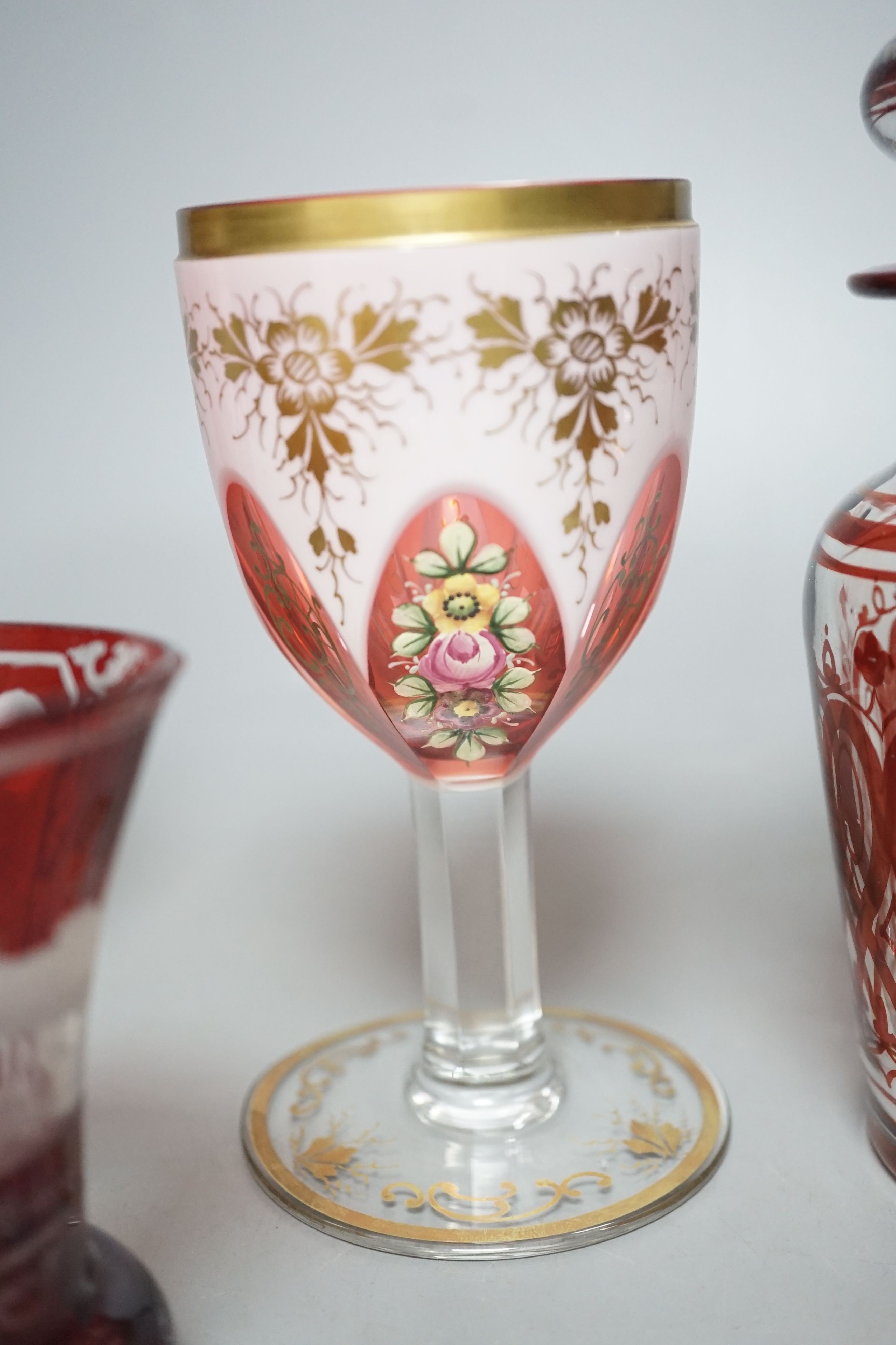A pair of 19th century Bohemian ruby overlaid wine glasses, possibly Moser and other bohemian ruby glasswares